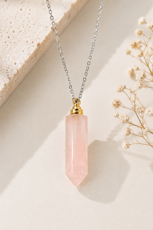 Natural Rose Quartz Crystal Diffuser Necklace with gold-tone cap on a neutral background. Hand selected by Heals N Crystal.